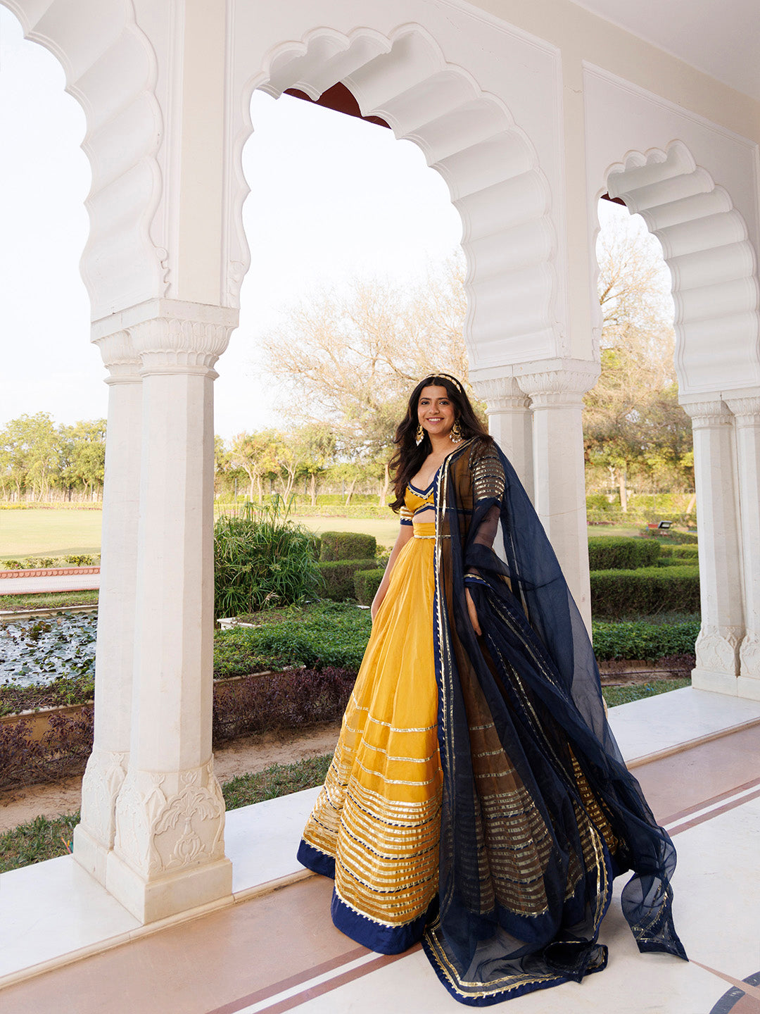 Sunset Gold Yellow and Navy Blue Lehenga Set BY RAGAVI