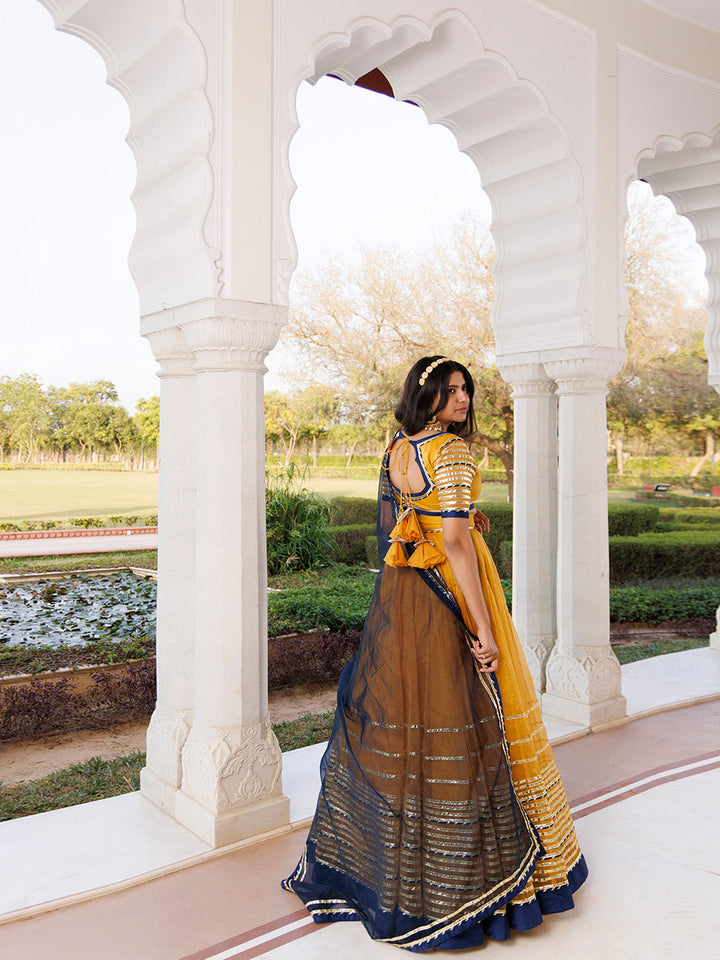 Sunset Gold Yellow and Navy Blue Lehenga Set BY RAGAVI