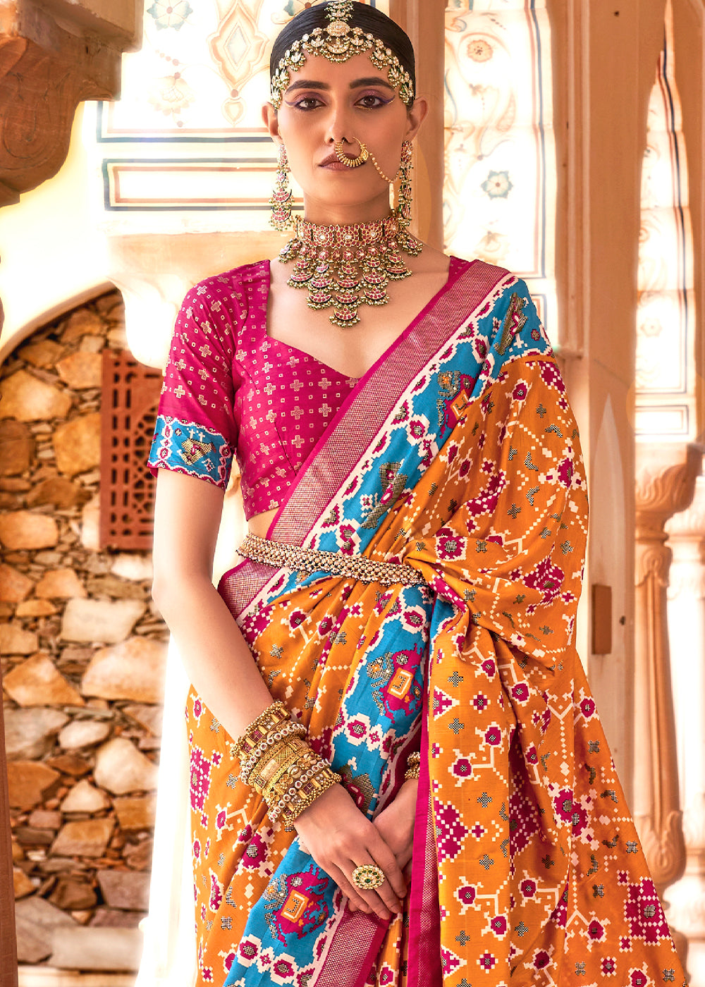  Traditional Indian Patola Silk Saree Featuring Orange Hues and Detailed Print