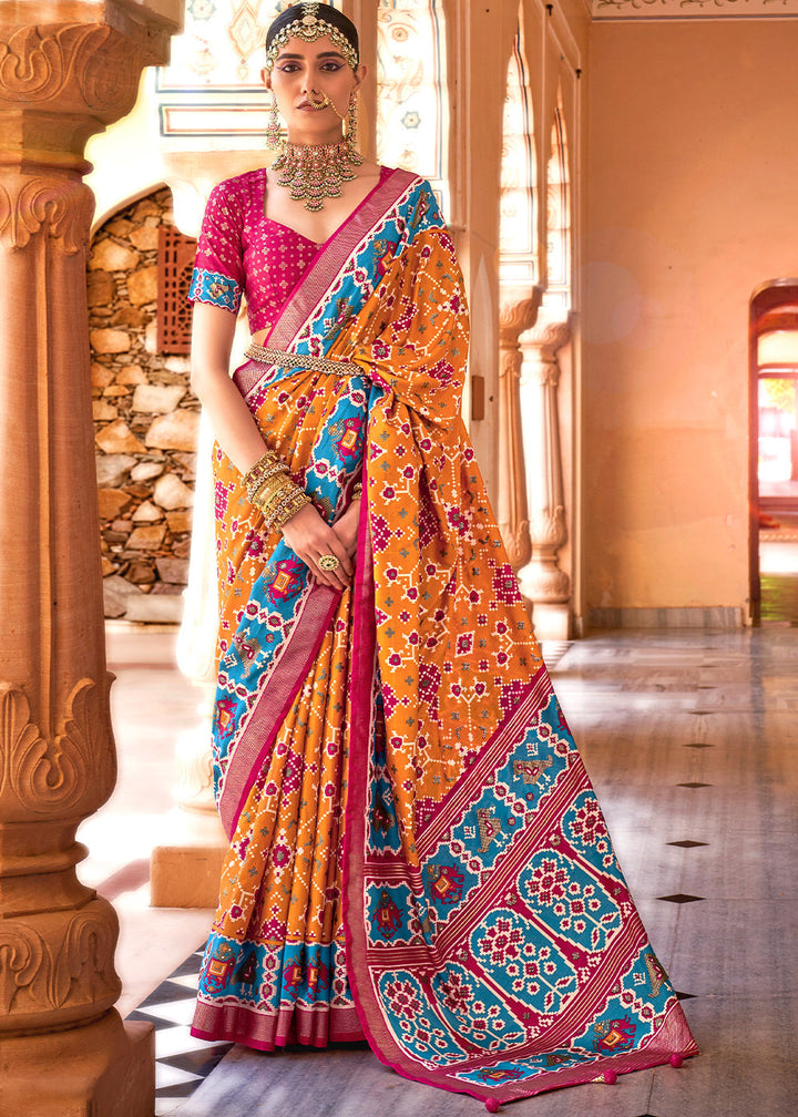 Atomic Orange Printed Patola Silk Saree with Intricate Floral Motifs and Gold Border