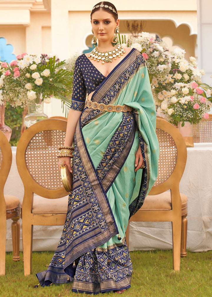 Blue and green printed Patola silk saree with intricate floral design