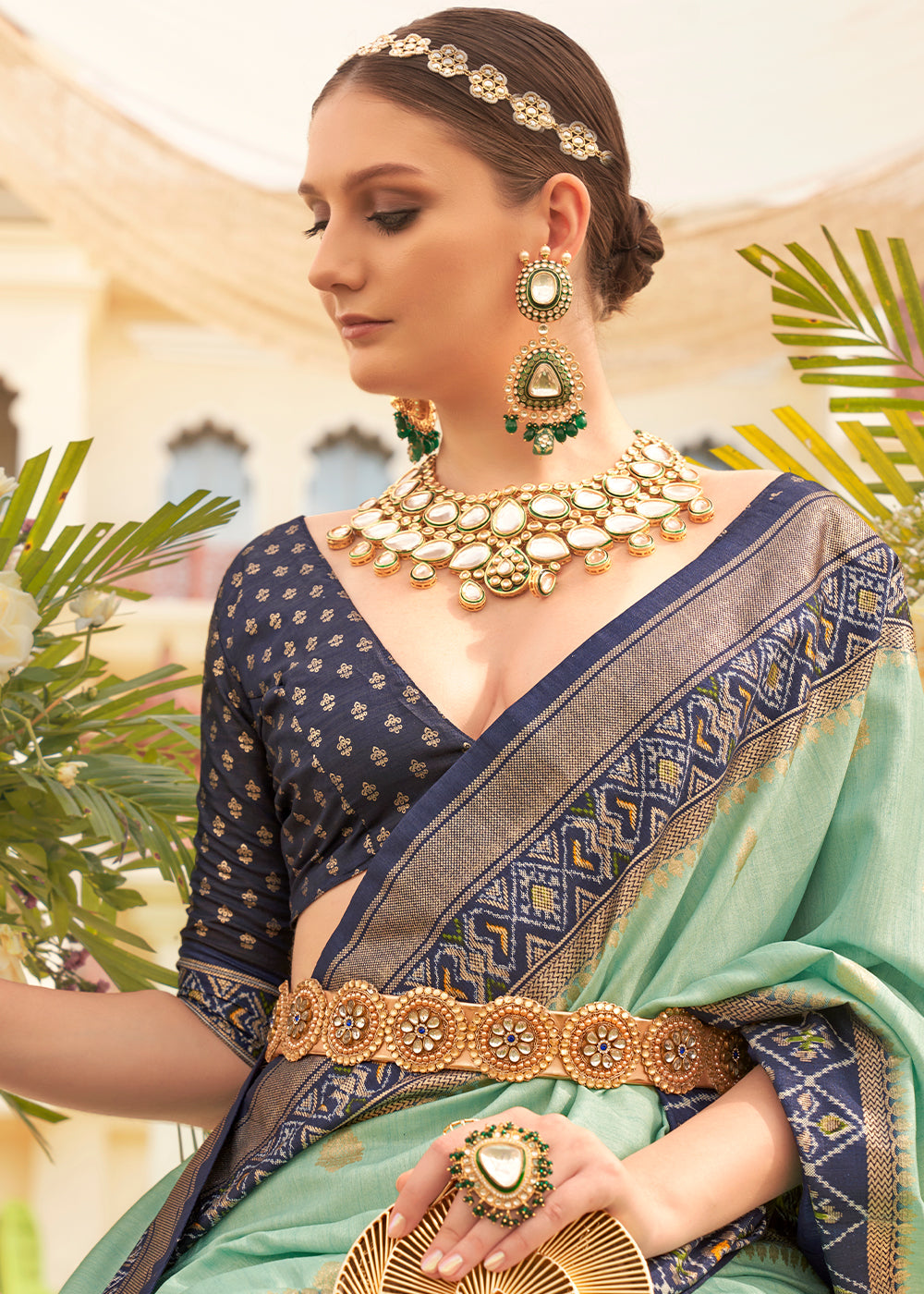  Elegant patola silk saree in shades of blue and green with traditional Indian motifs