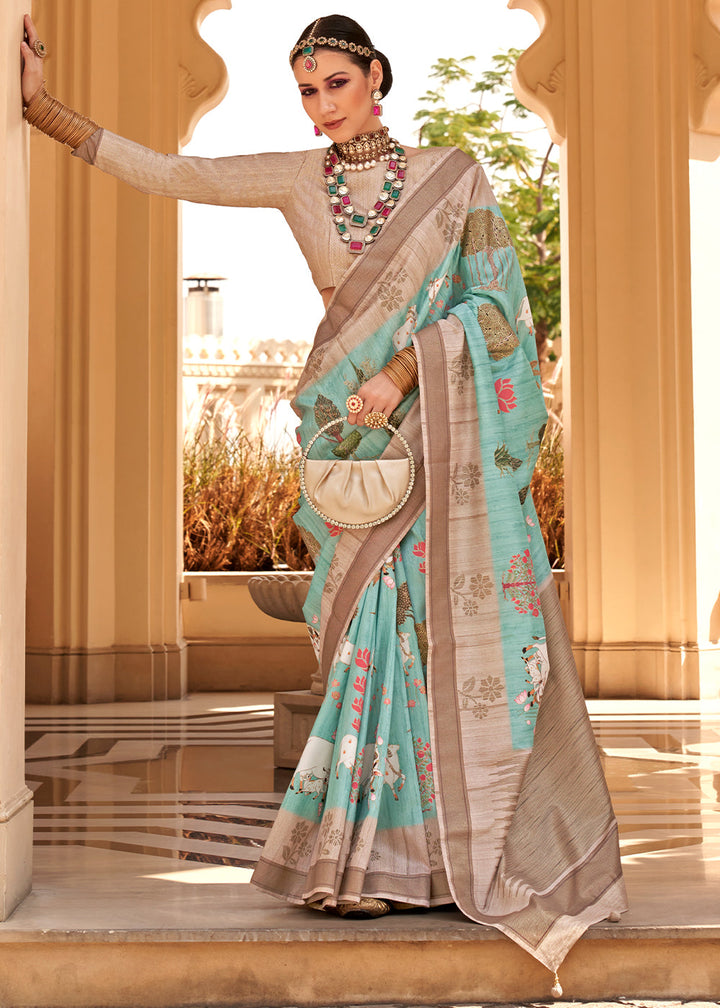 Close-up of Light Sea Green Khadi Printed Raw Silk Saree with intricate floral patterns and delicate golden border 