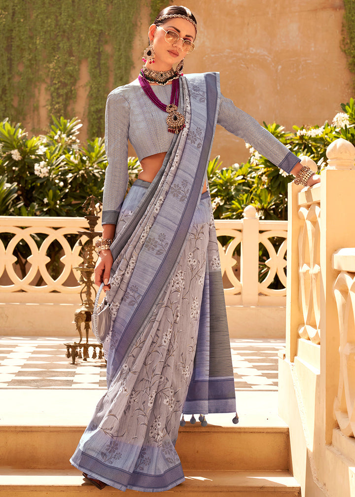 Light blue Khadi printed raw silk saree with intricate floral design and gold border