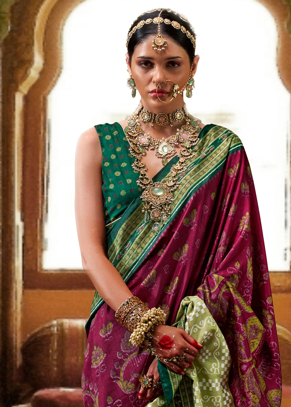 Beautiful Purple & Green Traditional Patola Printed Silk Saree with intricate designs