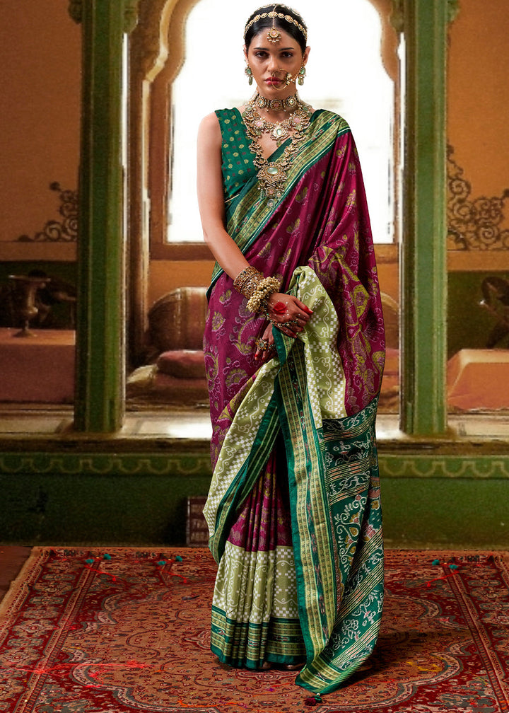 Exquisite purple and green traditional patola printed silk saree with intricate designs