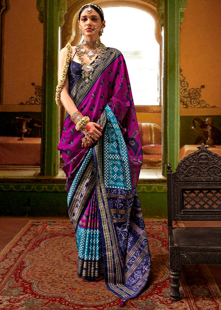 Beautiful pink and blue traditional Patola printed silk saree with intricate designs