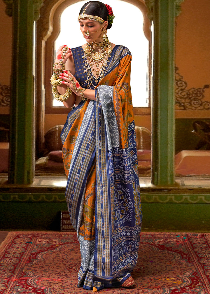 Orange and blue traditional patola printed silk saree with intricate patterns