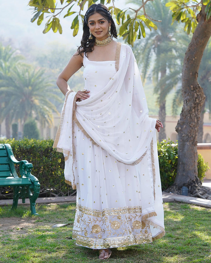  Elegant white designer gown featuring a beautiful blooming sequence embroidered work, perfect for special occasions 