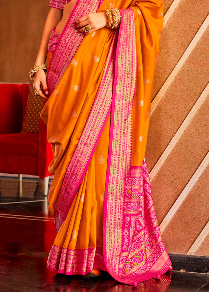 Beautiful mustard yellow silk saree featuring intricate and colorful Sambhal Puri design