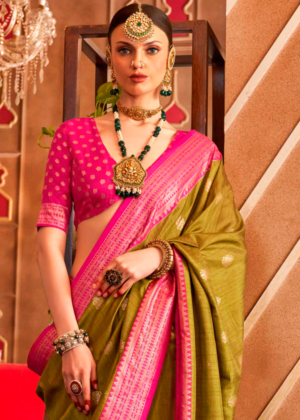 Beautiful olive green Patola silk saree featuring intricate Sambhal Puri print