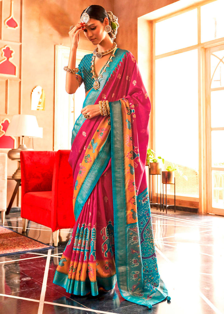 Magenta silk saree with intricate Sambhal Puri weaving and golden border