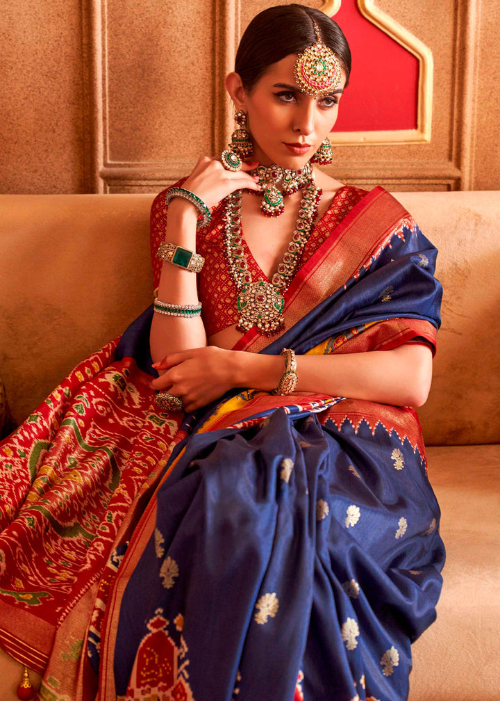 Traditional Indian saree in rich navy blue silk with intricate print