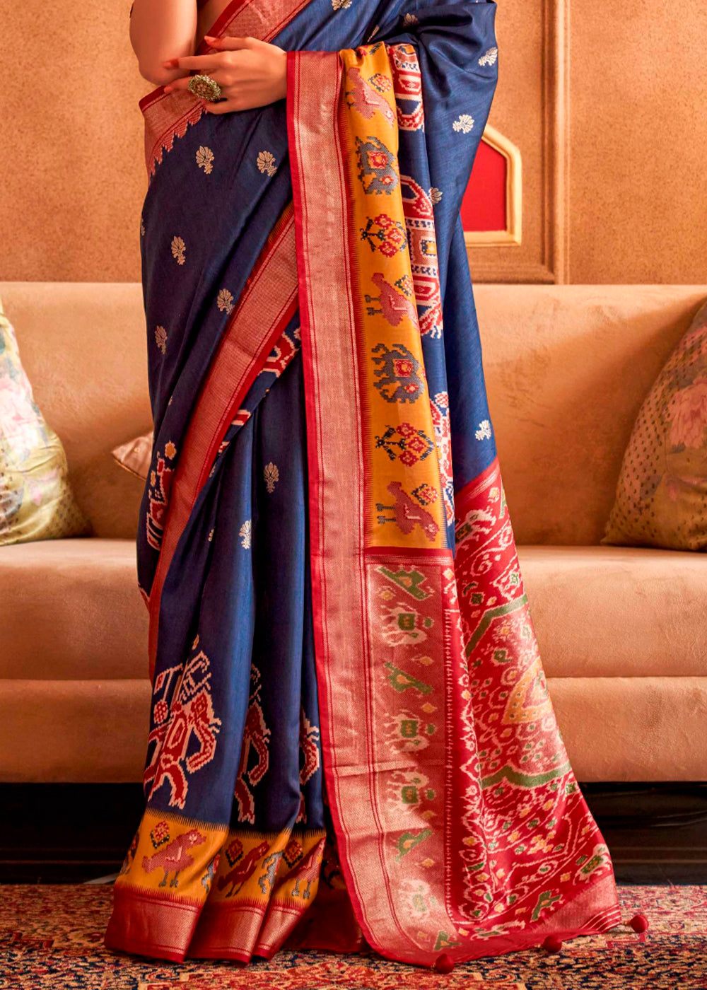 Luxurious silk saree featuring stunning navy blue hue and ornate print