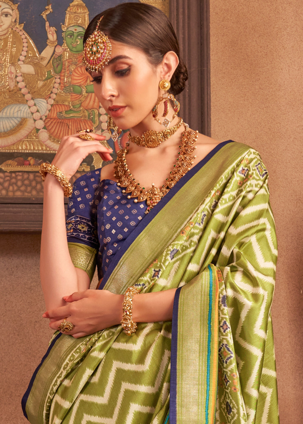 Beautiful venom green silk saree with patola print and contrast blouse