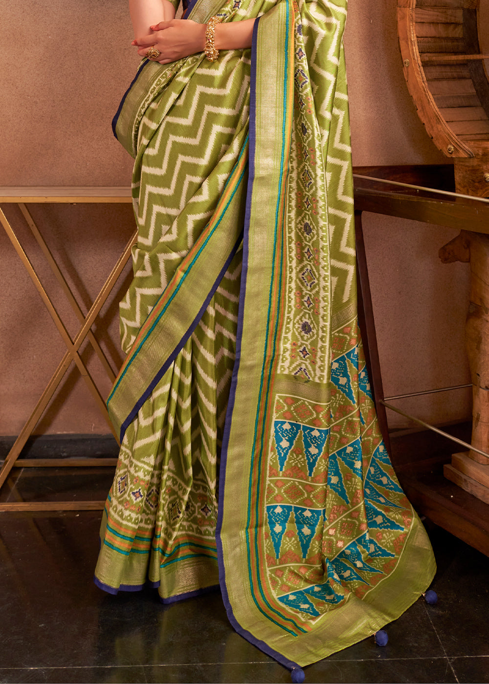 Beautiful venom green patola printed silk saree with contrasting blouse