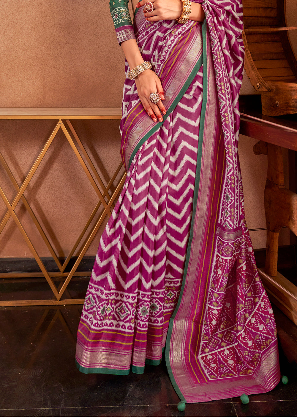 Purple silk saree with contrasting blouse in traditional Indian style