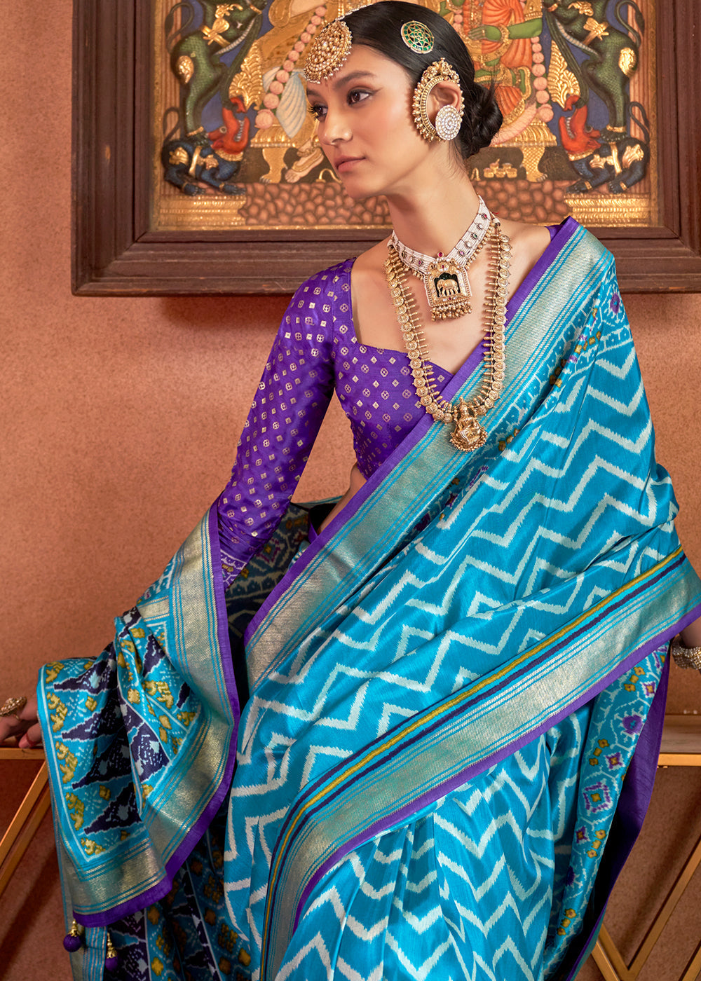 Elegant cerulean blue patola printed silk saree with contrasting blouse, perfect for special occasions and cultural events