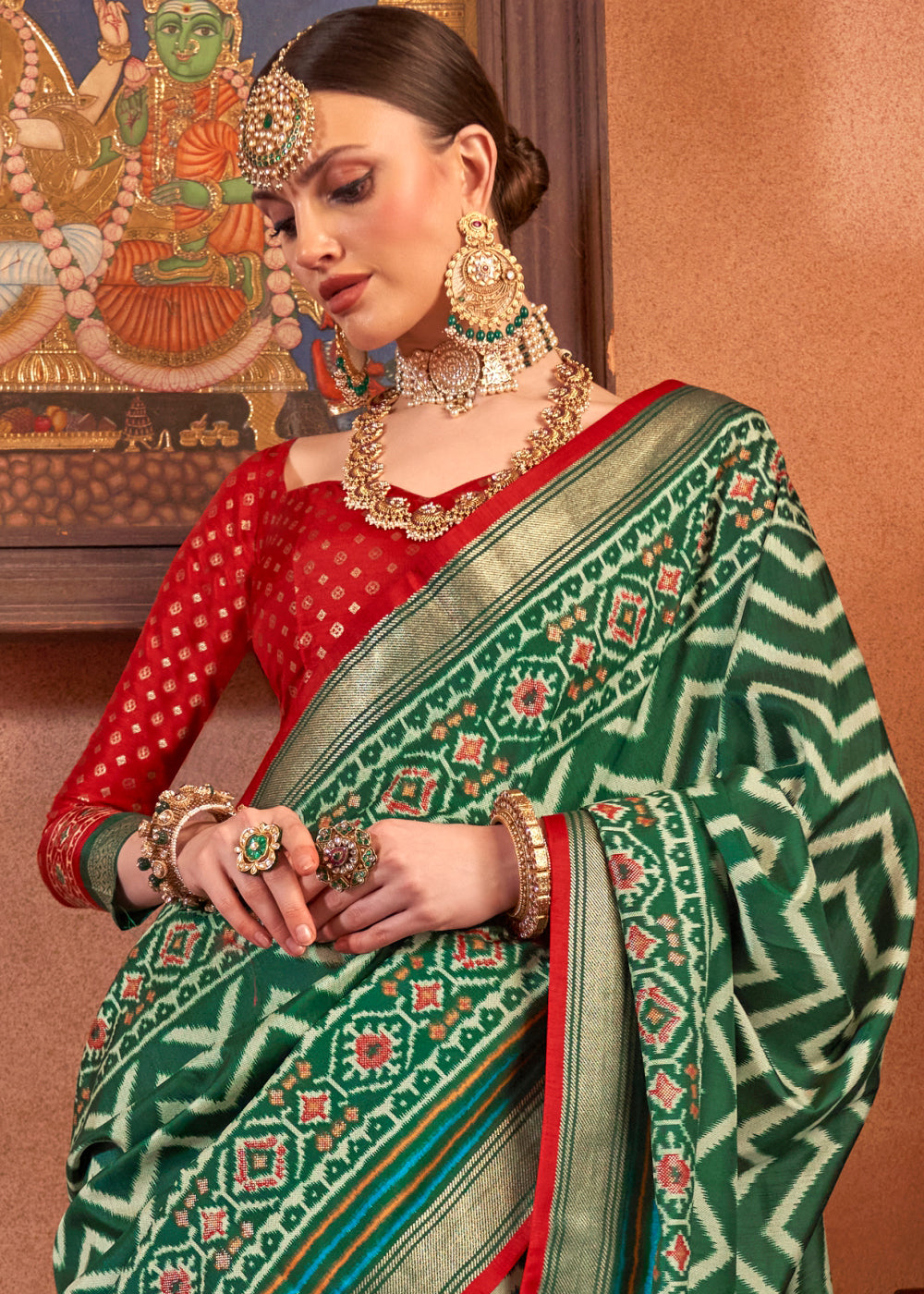 Dark Green Patola Printed Silk Saree with Contrast Blouse