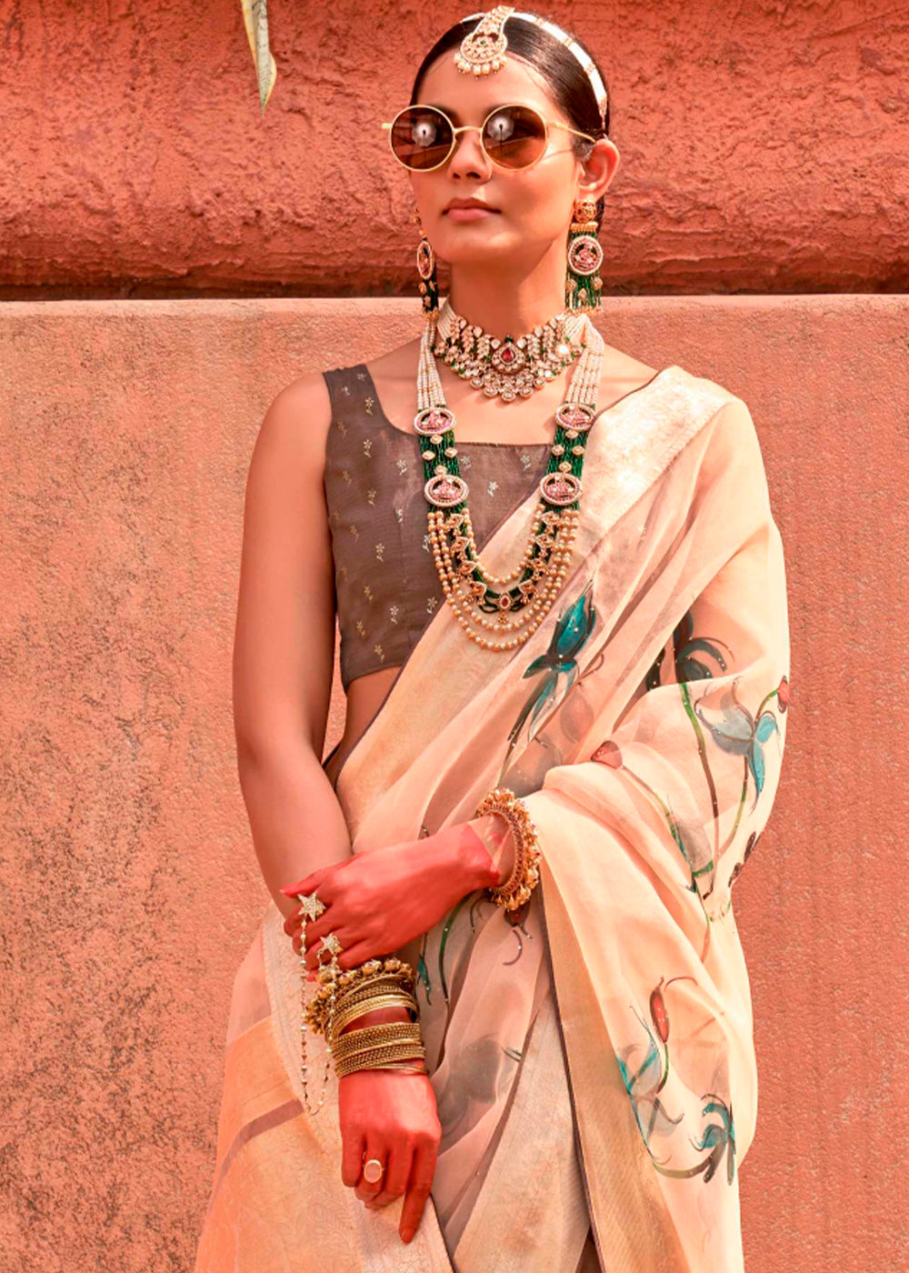 Beautiful beige and brown saree made of organza silk with floral design