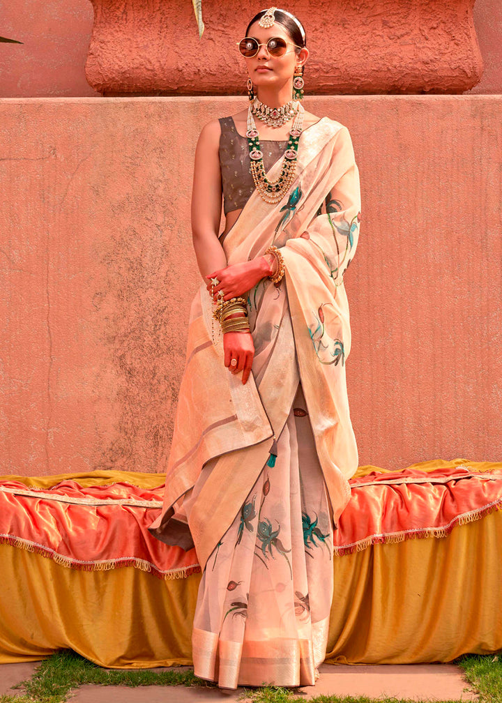 Beige brown floral organza silk saree with intricate embroidery and gold accents, perfect for special occasions or cultural events in India 