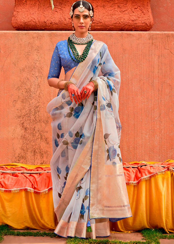 Designer organza silk saree with sky blue floral print and intricate detailing