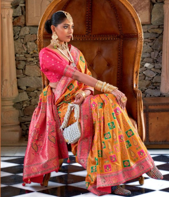 Cadmium Orange Peacock Motif Banarasi brocade Reception Saree With Contrast Border