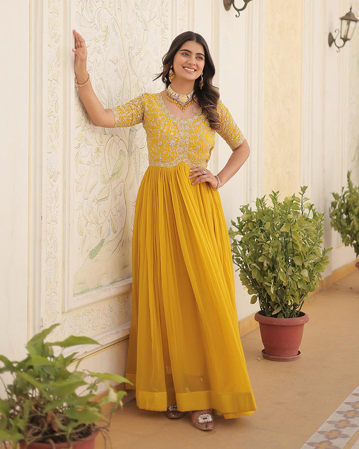 Yellow Color Faux Blooming Zari sequence Embroidered Gown  - By Qivii