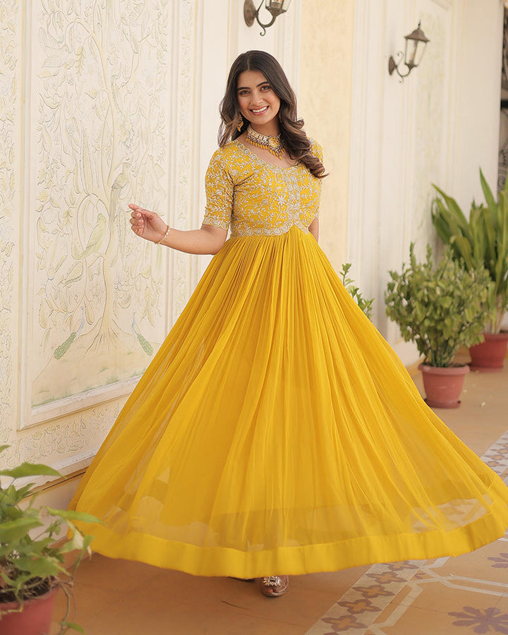 Yellow Color Faux Blooming Zari sequence Embroidered Gown  - By Qivii