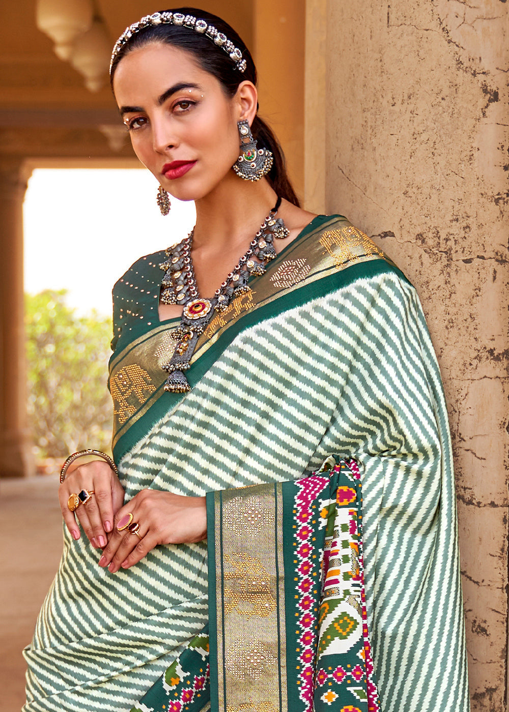 Dark Green Designer Patola Silk Saree with Zari Border & Stone work - qivii