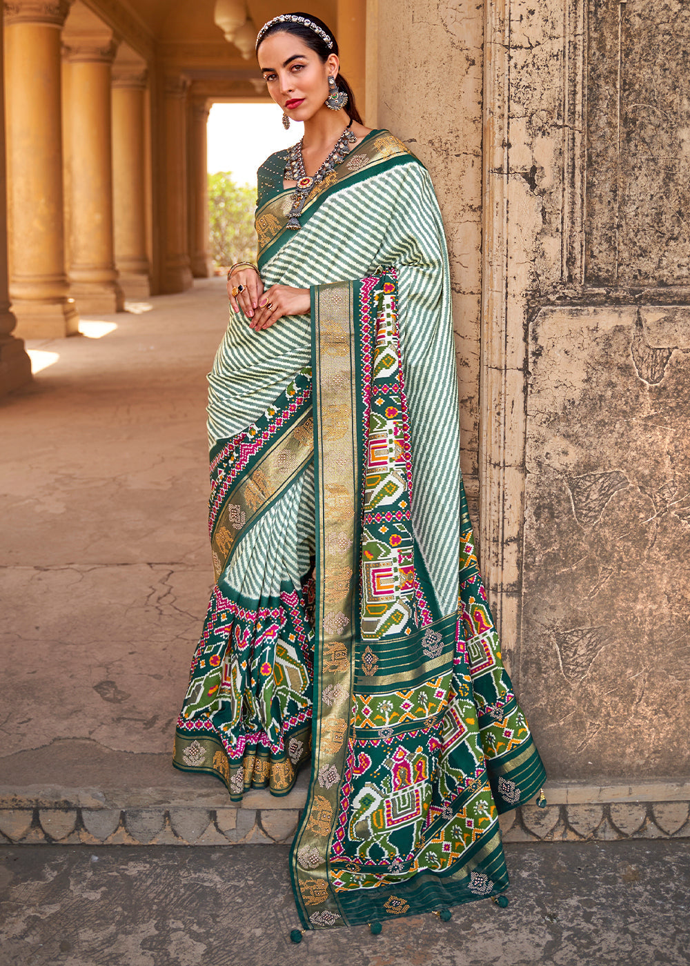Dark Green Designer Patola Silk Saree with Zari Border & Stone work - qivii