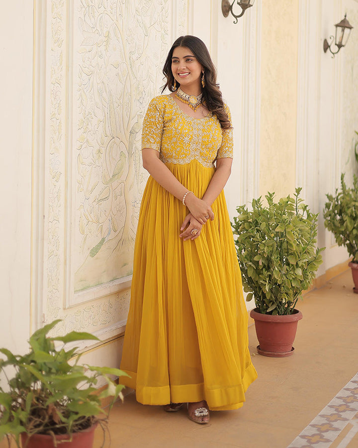 Yellow Color Faux Blooming Zari sequence Embroidered Gown  - By Qivii