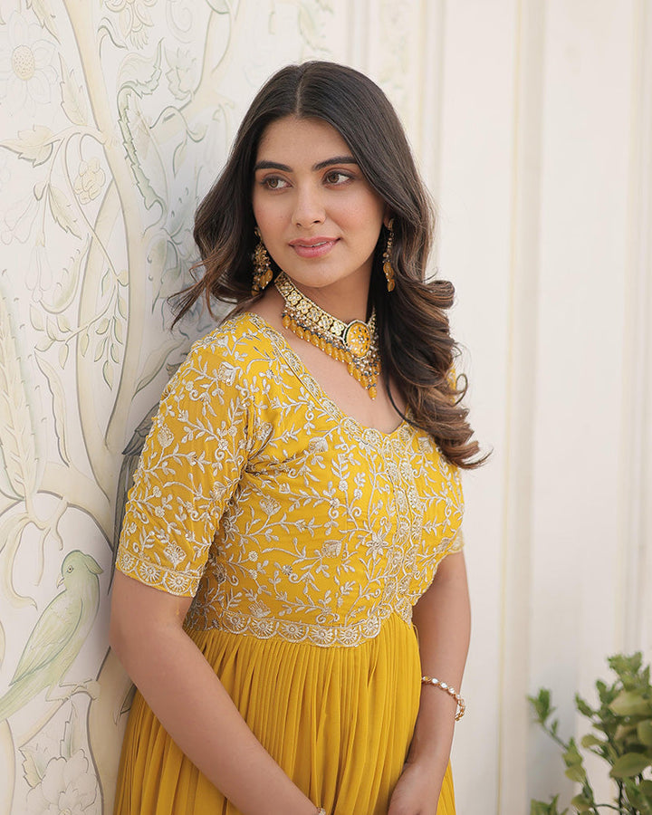 Yellow Color Faux Blooming Zari sequence Embroidered Gown  - By Qivii