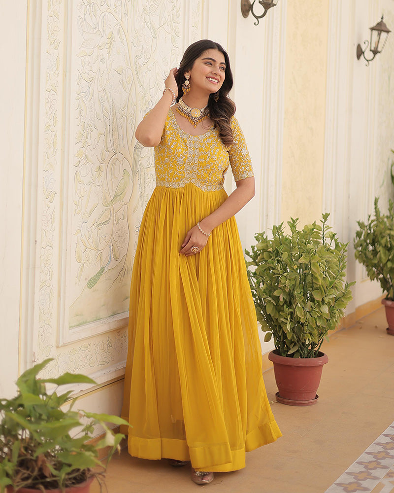 Yellow Color Faux Blooming Zari sequence Embroidered Gown  - By Qivii