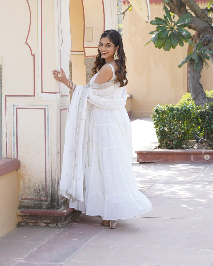 Elegant and flowing white georgette gown with frill details and matching dupatta by Qivii