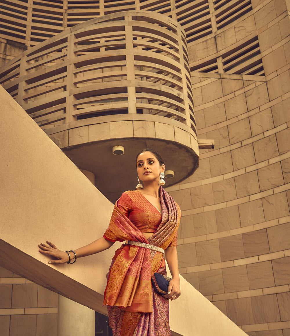  Beautiful woman wearing rose pink Banarasi silk saree with traditional zari design