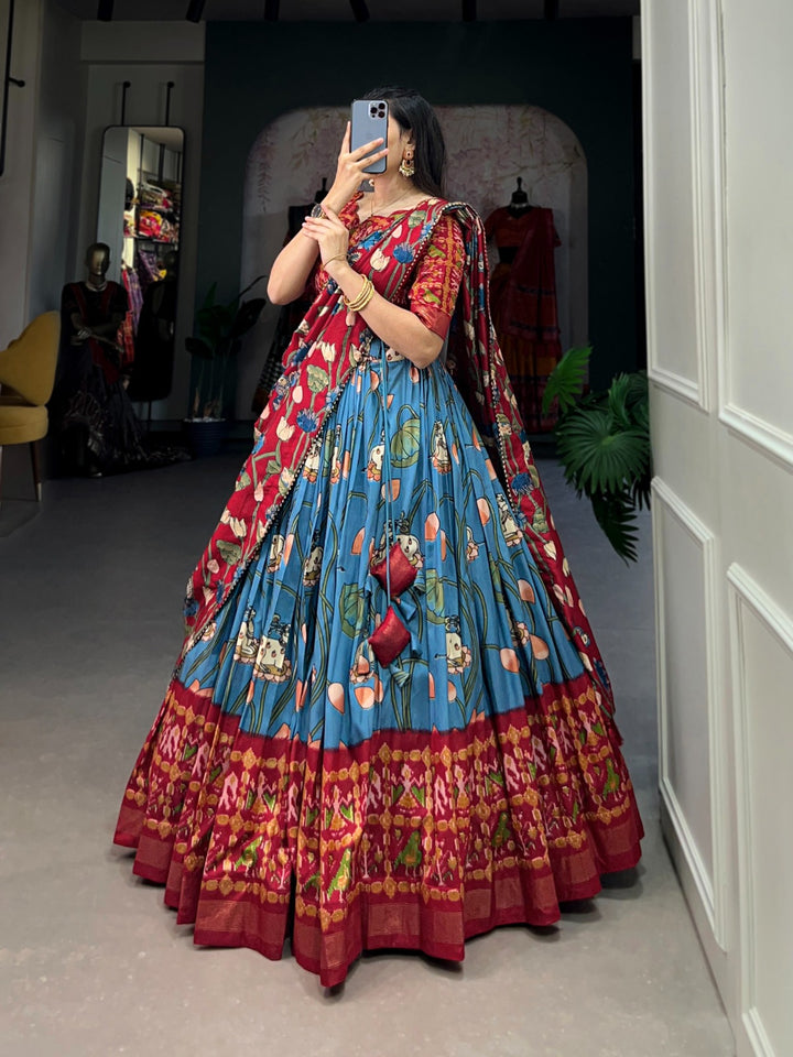 Teal Pichwai and Patola Printed Tussar Silk Lehenga Choli with intricate hand embroidery and rich traditional motifs