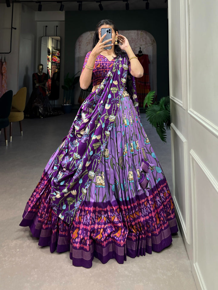 Lavender Pichwai and Patola Printed Combination Tussar Silk Lehenga Choli with intricate floral motifs and vibrant colors showcased in a traditional Indian attire 