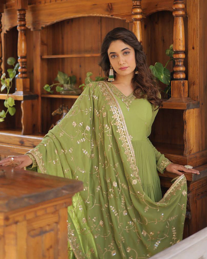 Beautiful parrot green color faux georgette designer anarkali gown with dupatta by Qivii, featuring stunning traditional embroidery and flowing silhouette