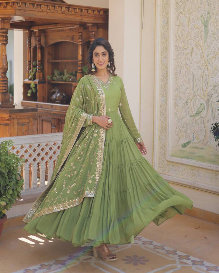  Stunning back view of the parrot green color faux georgette designer anarkali gown with dupatta by Qivii, showcasing the intricate design and flattering fit