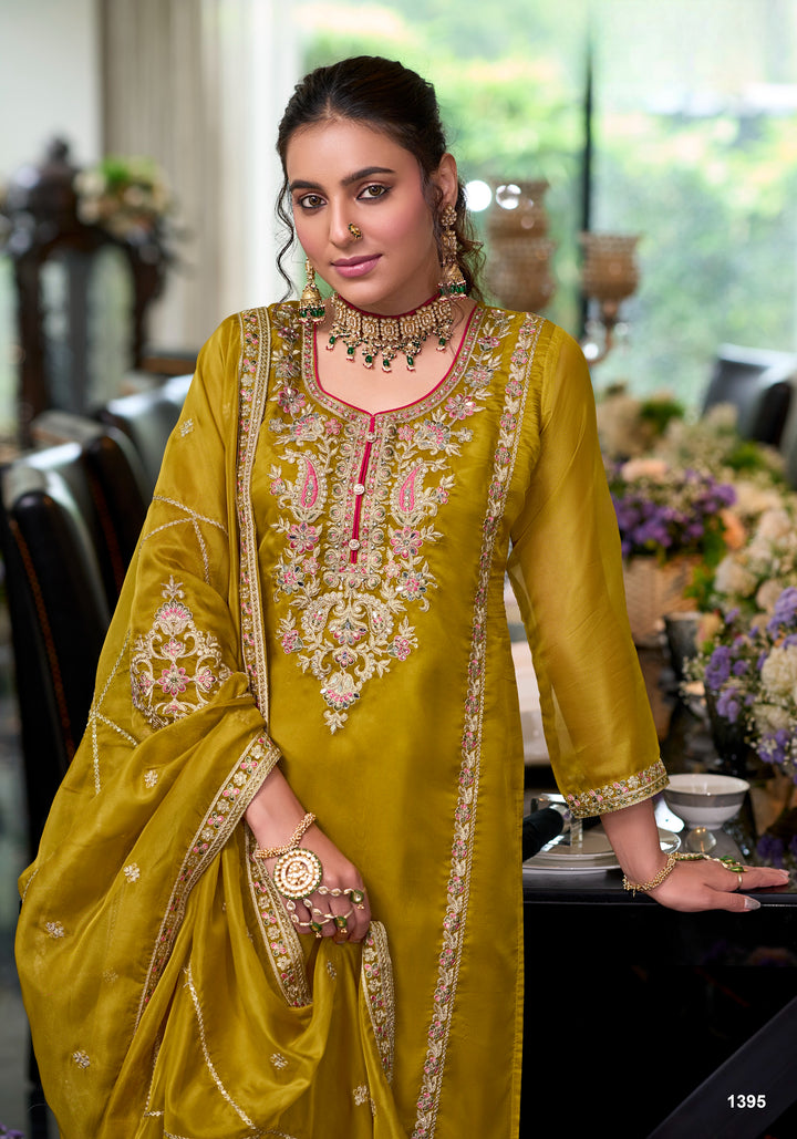 Yellow soft organza with embroidery heavy silk salwar suit