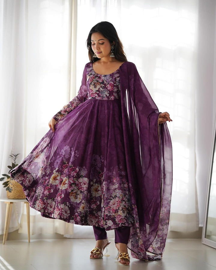 This image showcases the stunning three-piece anarkali suit by Qivii, featuring a beautiful wine color and delicate floral print on organza fabric