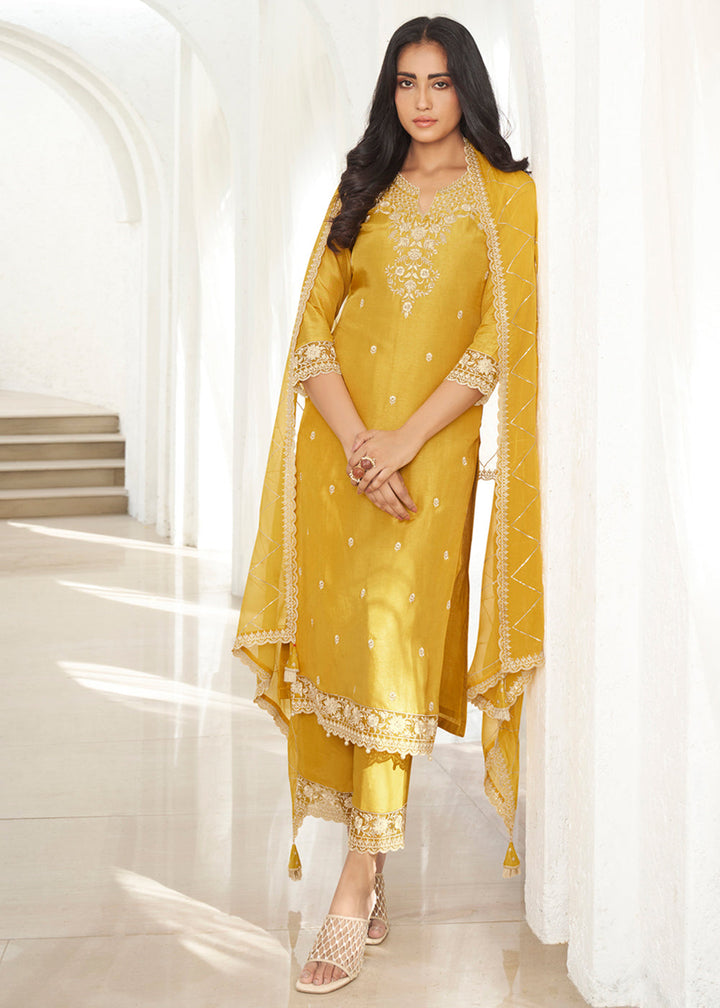 Amber Yellow Dola Silk Kurta . Paired with Santoon Straight Pants and Organza Dupatta