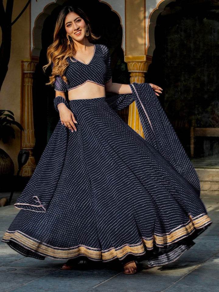 Elegant black lehenga with leheriya print and lace detailing