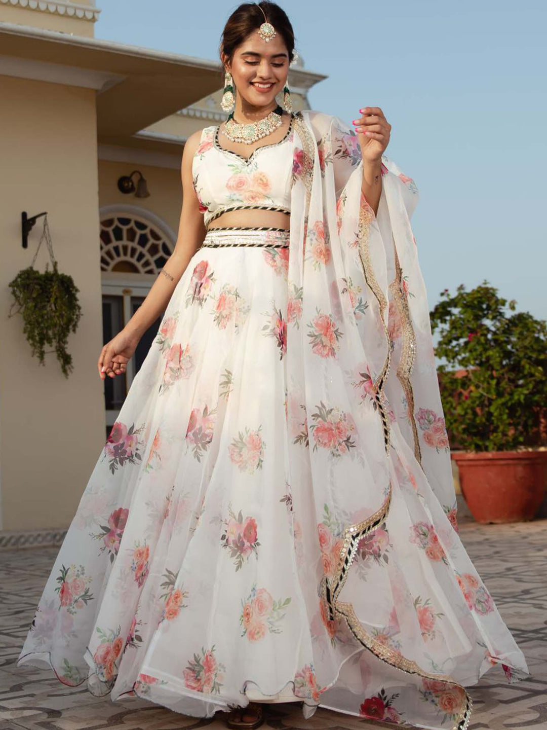 White color organza lehenga with digital floral print and intricate embroidery work