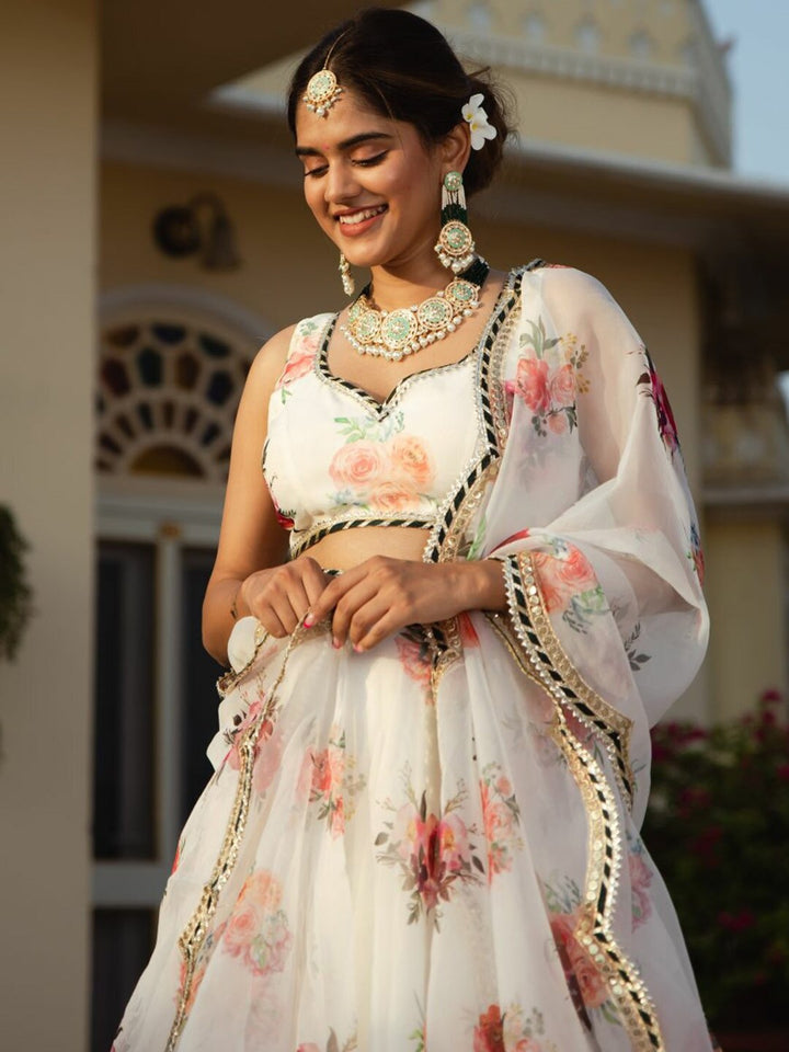 White organza lehenga with digital floral print and intricate embroidery details