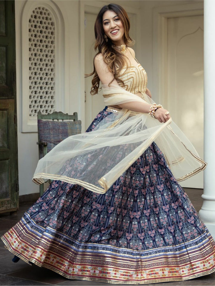 Blue color organza floral digital print lehenga with intricate embroidery detail