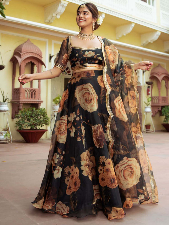 Beautiful black organza lehenga with redham and zari embroidery, digital print, and real mirror work blouse for a stunning traditional look