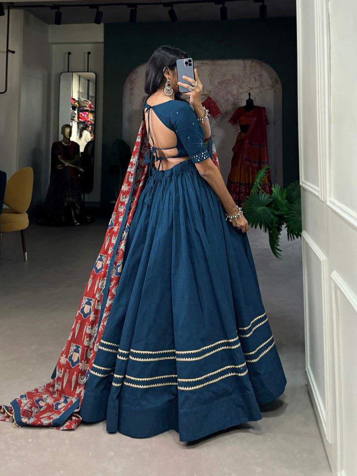 Traditional Indian lehenga choli in teal cotton with beautiful details