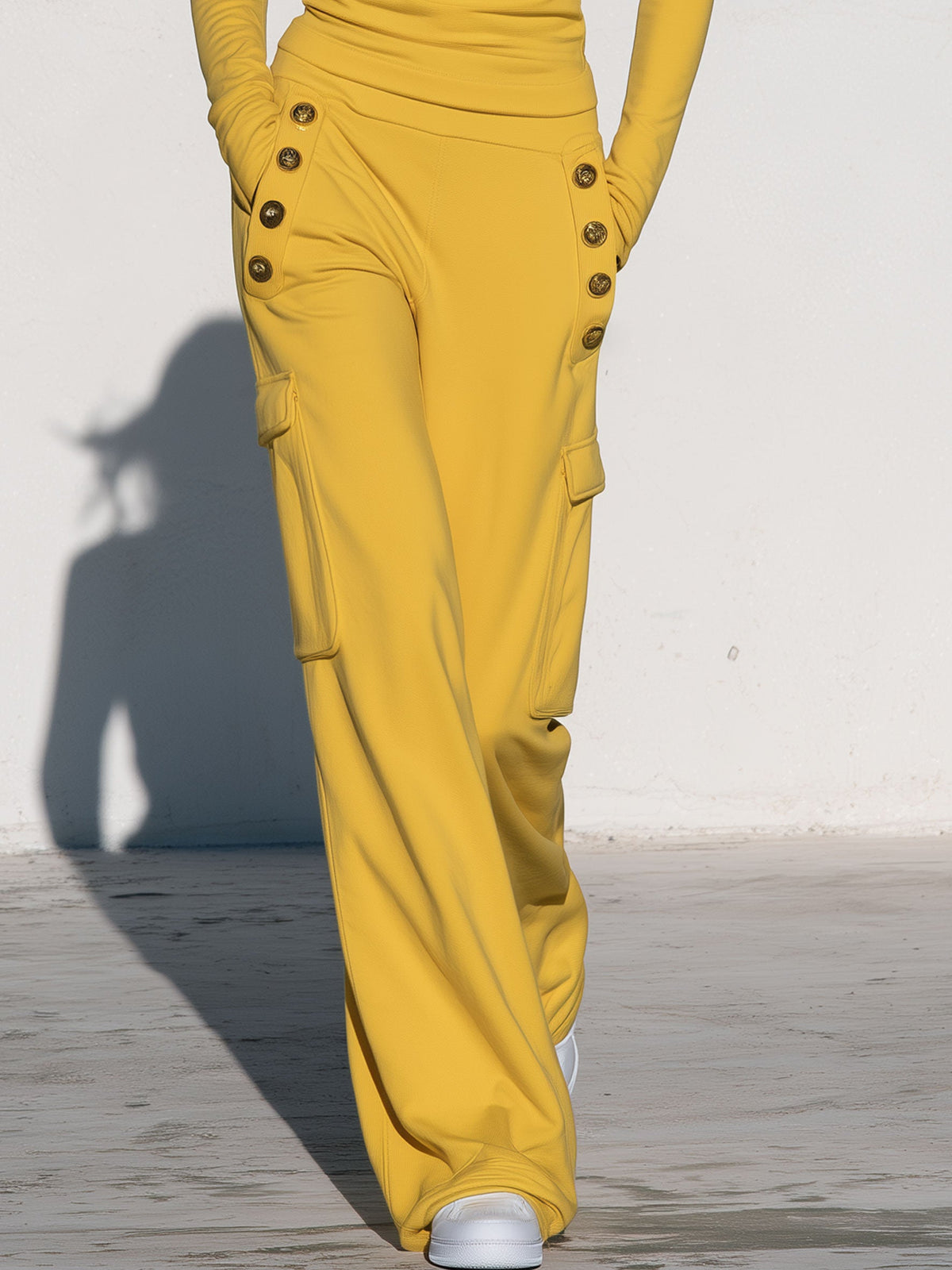 Yellow women's turtleneck long-sleeved top paired with black-trim cargo pants, stylish Oyrosy Clothing set for women.